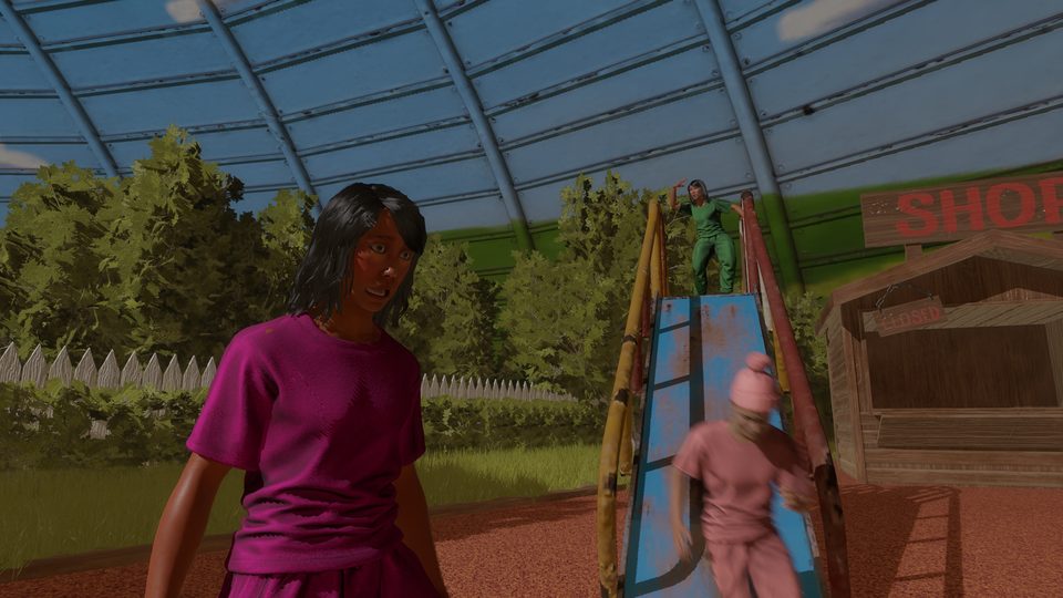 A player by the playground slide under the dome.